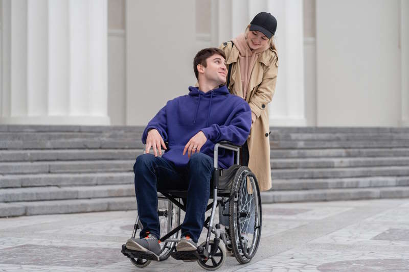 Man in Wheelchair with Friend