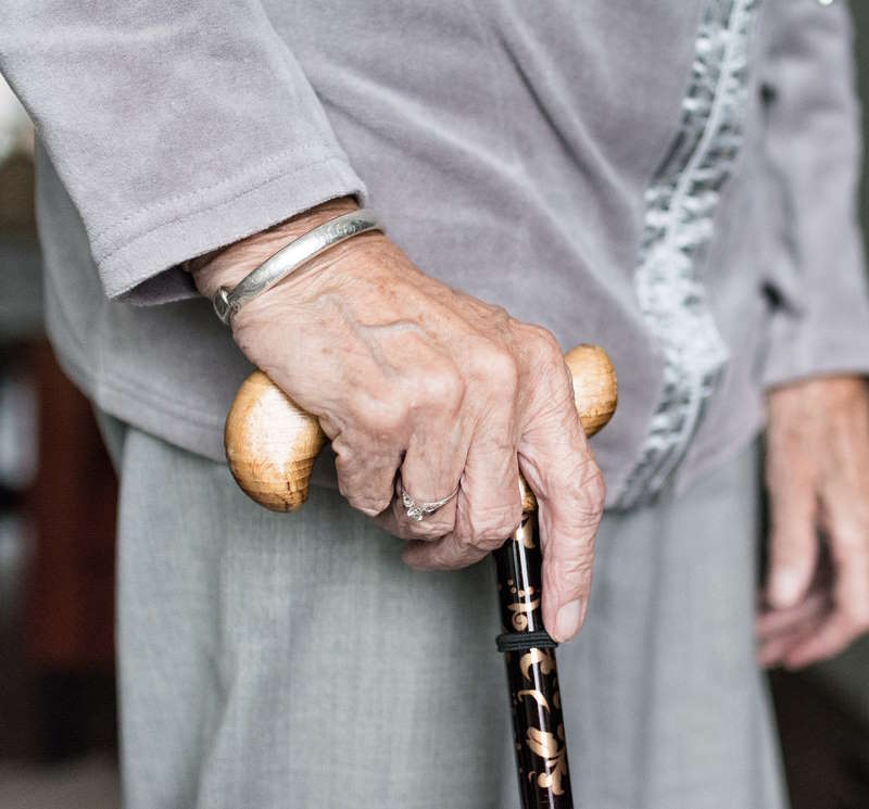 Senior Woman using cane
