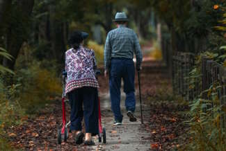 Elderly Couple Walking Park