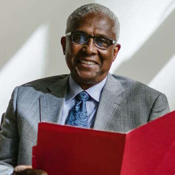 Senior Man Holding Folders